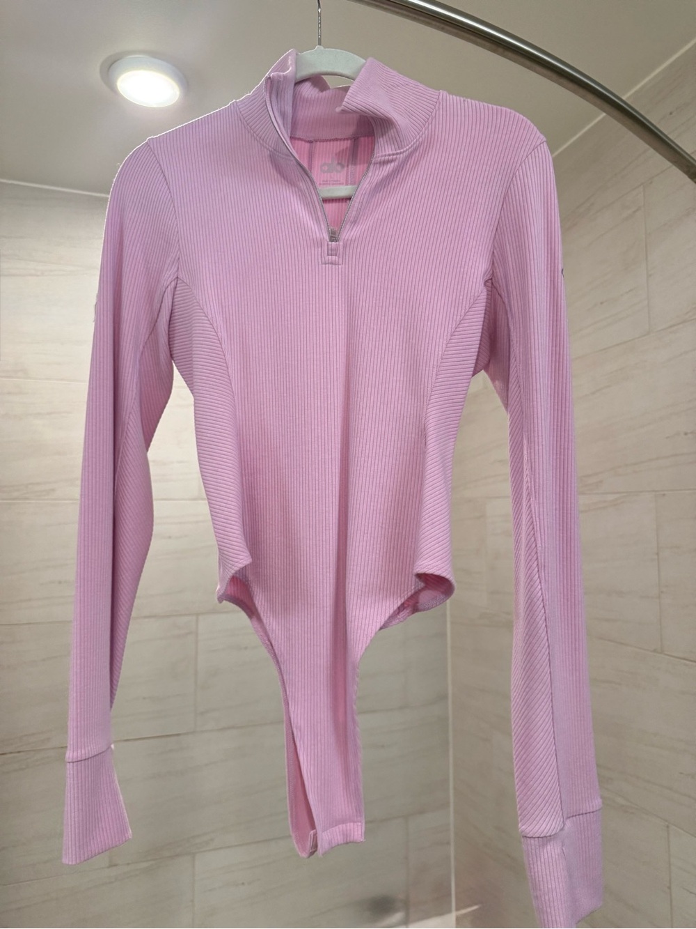 ALO Yoga Ribbed Quarter-Zip Long Sleeve Bodysuit - Light Pink